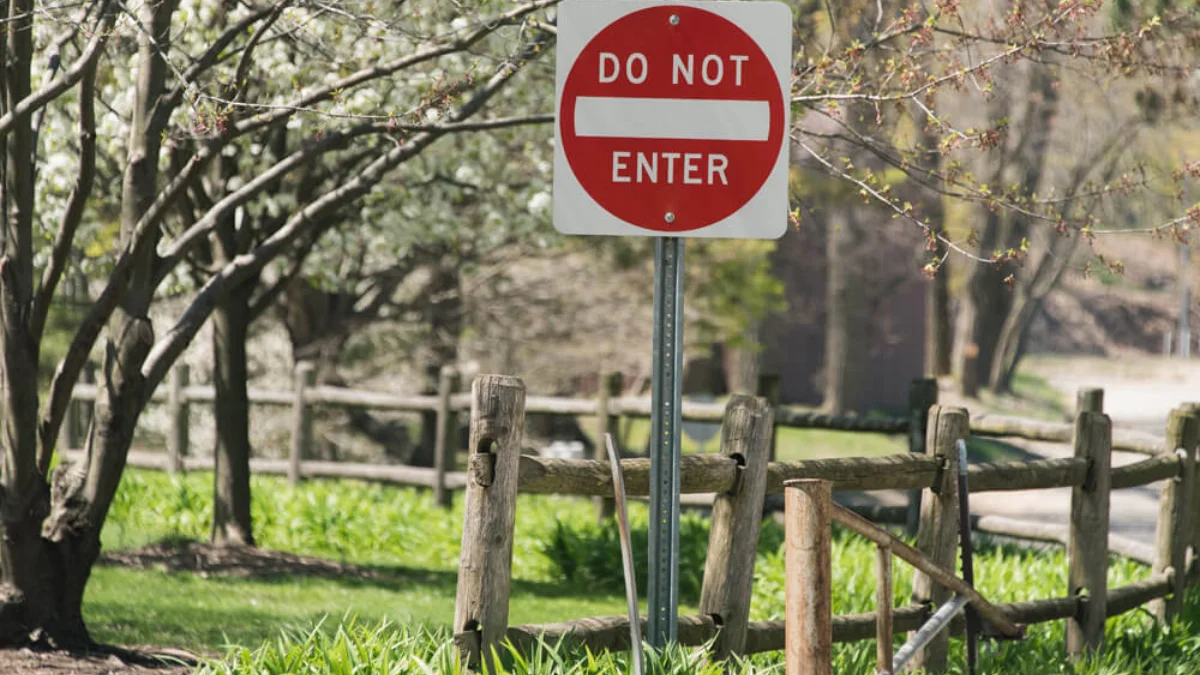 Red and white Do Not Enter sign marking a one-way street entrance in the United States
